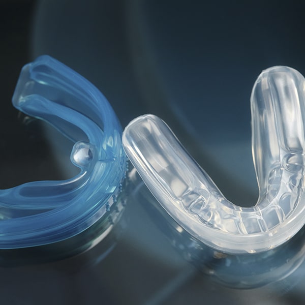 Transparent and blue mouthguards