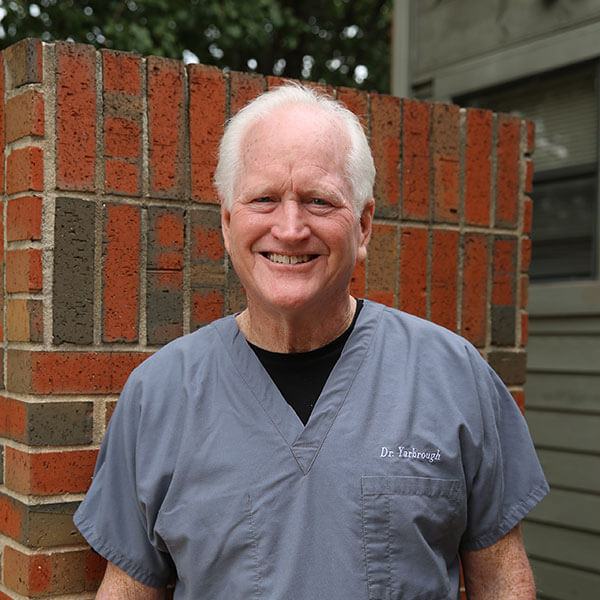Dr. Steven Yarbrough, in gray scrubs