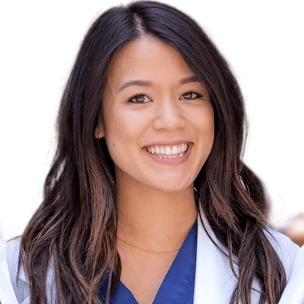 Dr. Tu wearing her white coat smiling.